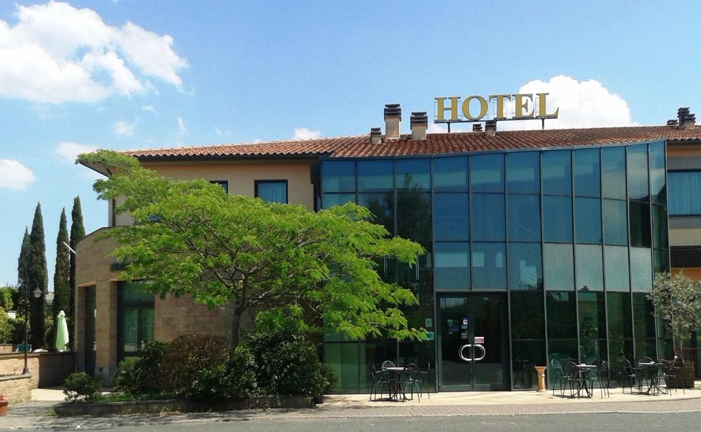 a hotel building with a sign on top of it at Hotel Semifonte in Poggibonsi