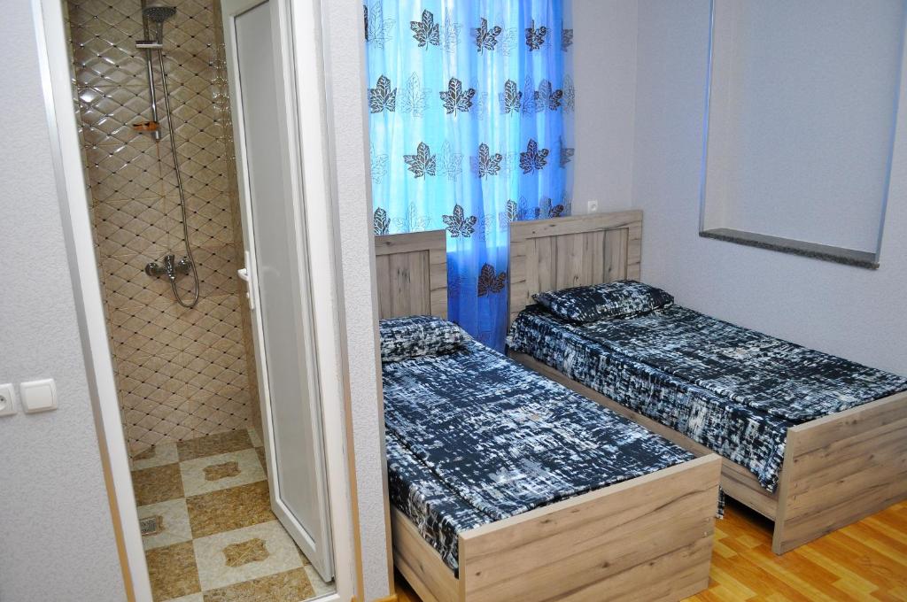 Postel nebo postele na pokoji v ubytování Sofia Guest House