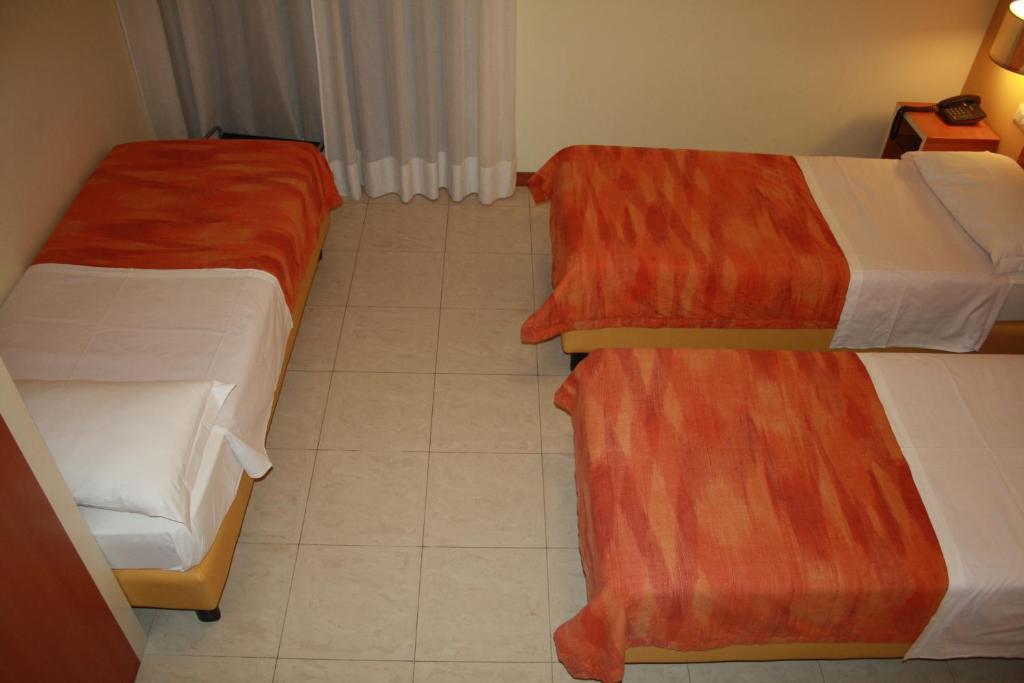 Postel nebo postele na pokoji v ubytování Hotel GF