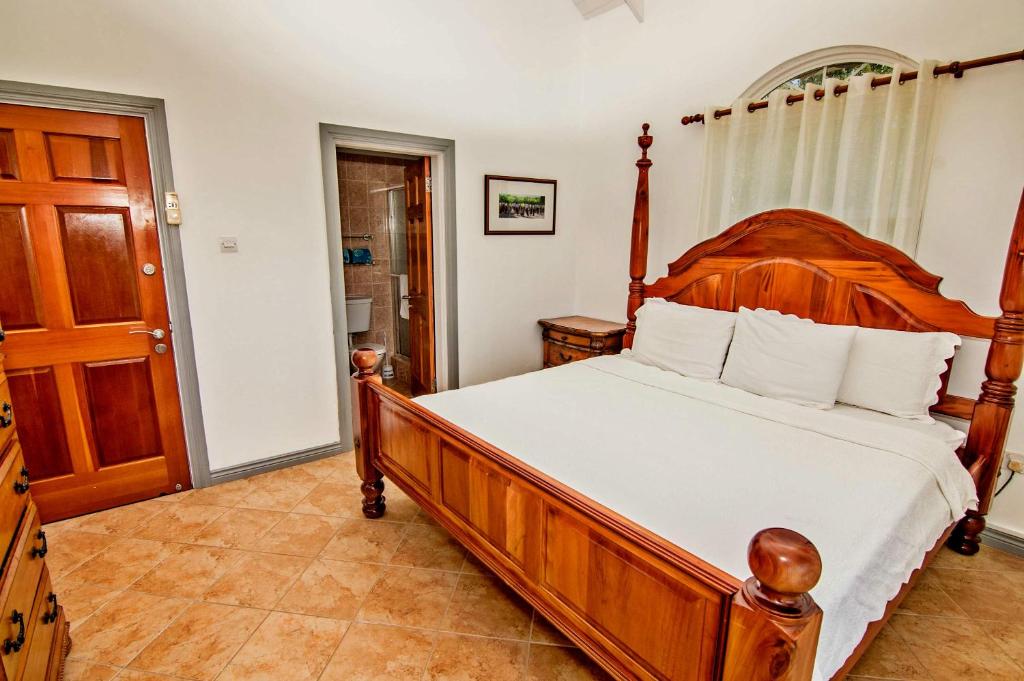 Postel nebo postele na pokoji v ubytování Paradise Cove