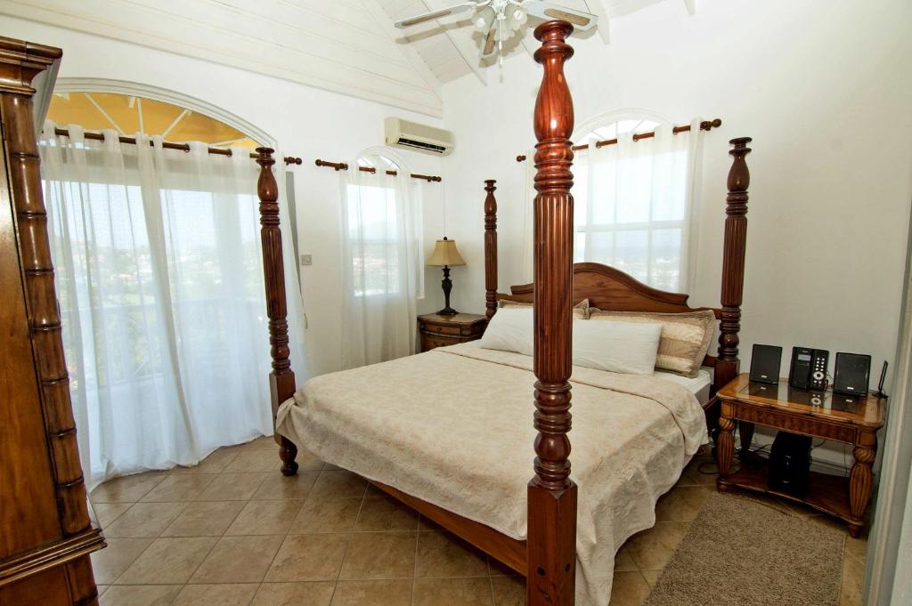 Postel nebo postele na pokoji v ubytování Paradise Cove