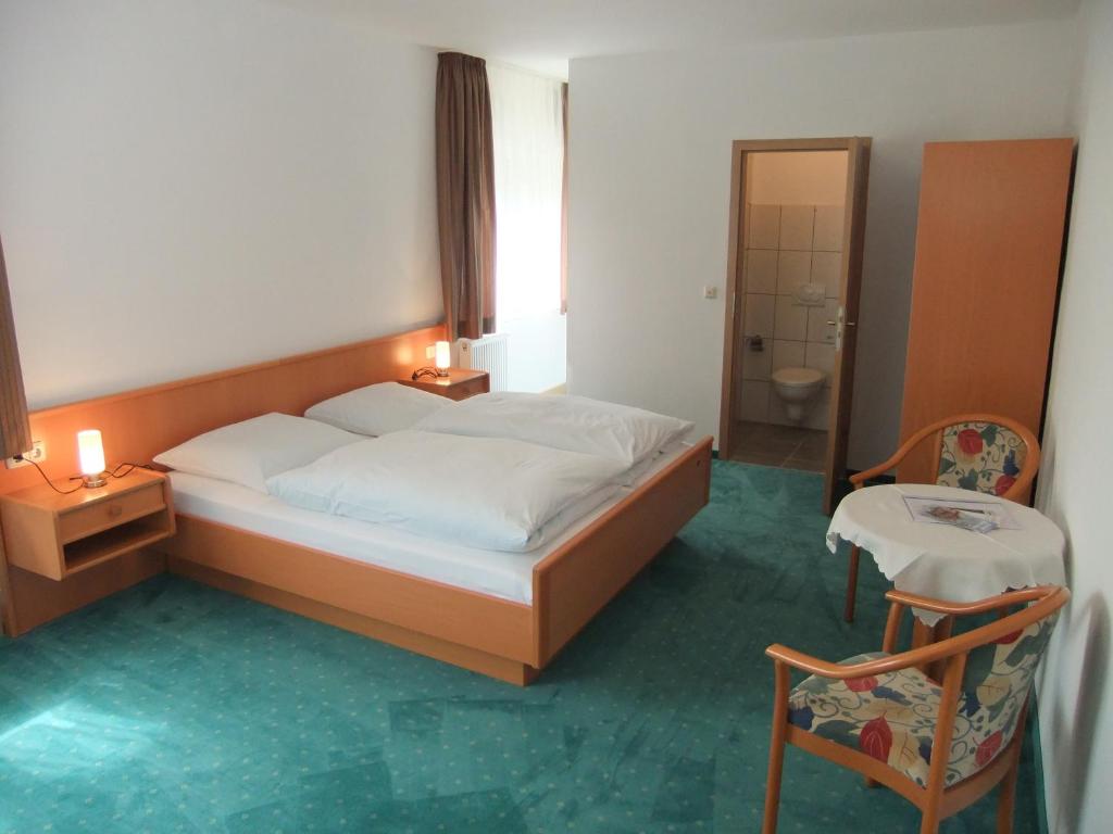 Postel nebo postele na pokoji v ubytování Gasthof Rotes Roß