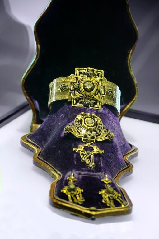 a gold and purple vase on a table at Hotel Bagués, a Small Luxury Hotel of the World in Barcelona