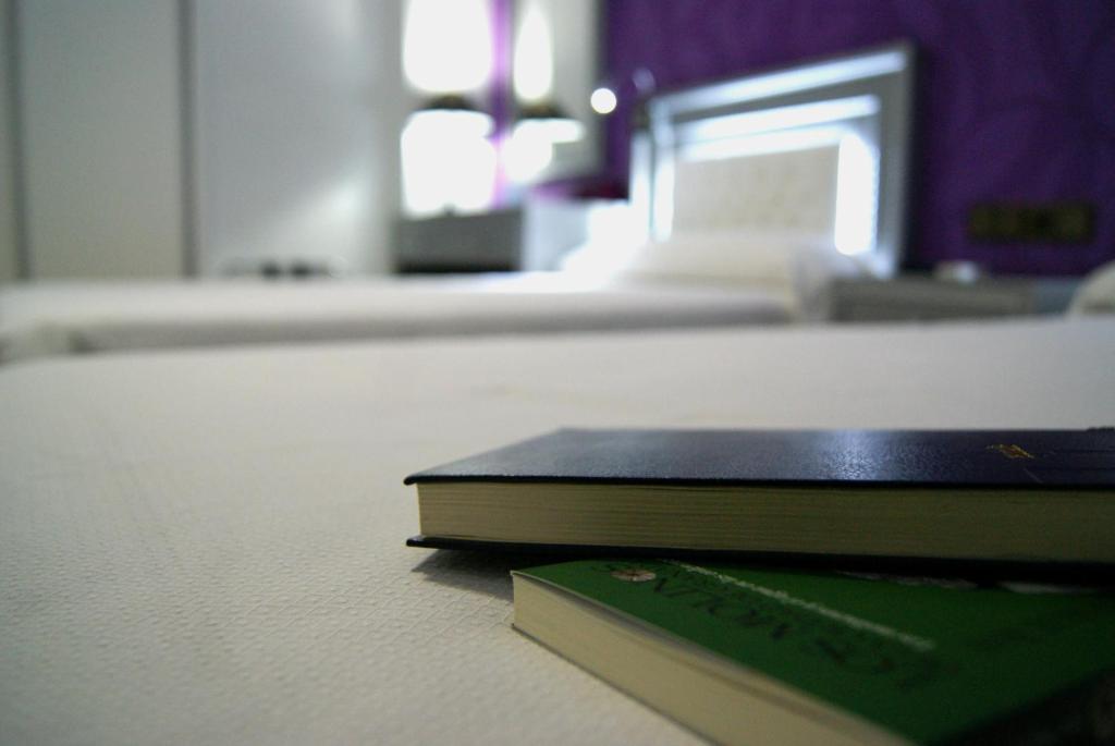 a book sitting on the floor in a room at Hotel Molinos in Granada