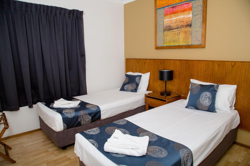 Postel nebo postele na pokoji v ubytování Cullen Bay Resorts