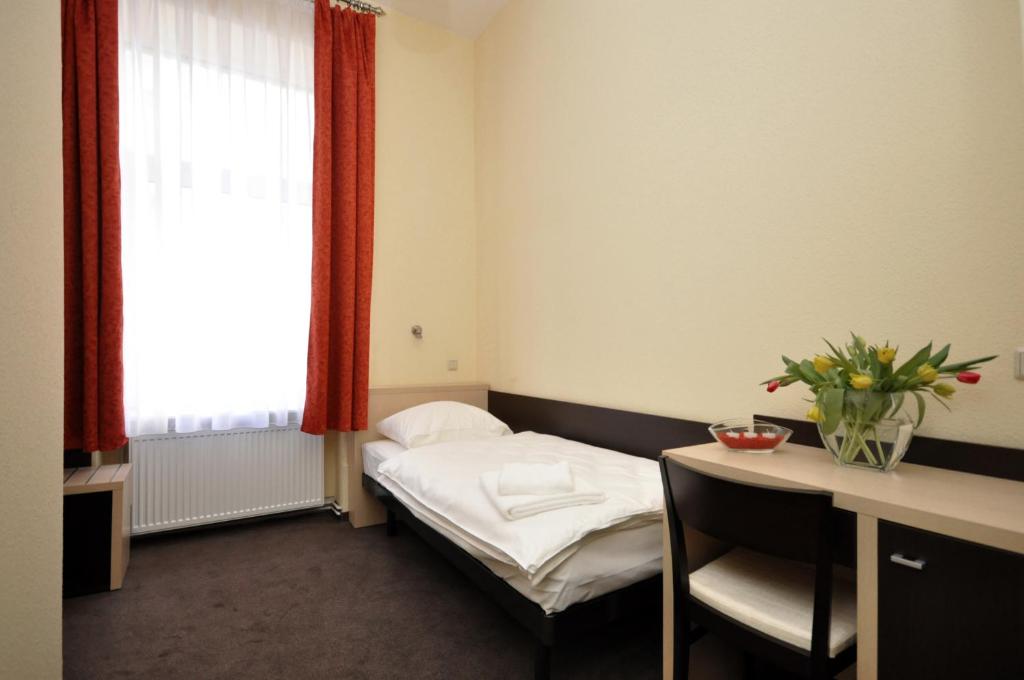 Postel nebo postele na pokoji v ubytování Hotel Bova
