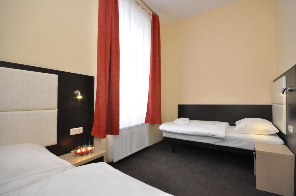 Postel nebo postele na pokoji v ubytování Hotel Bova