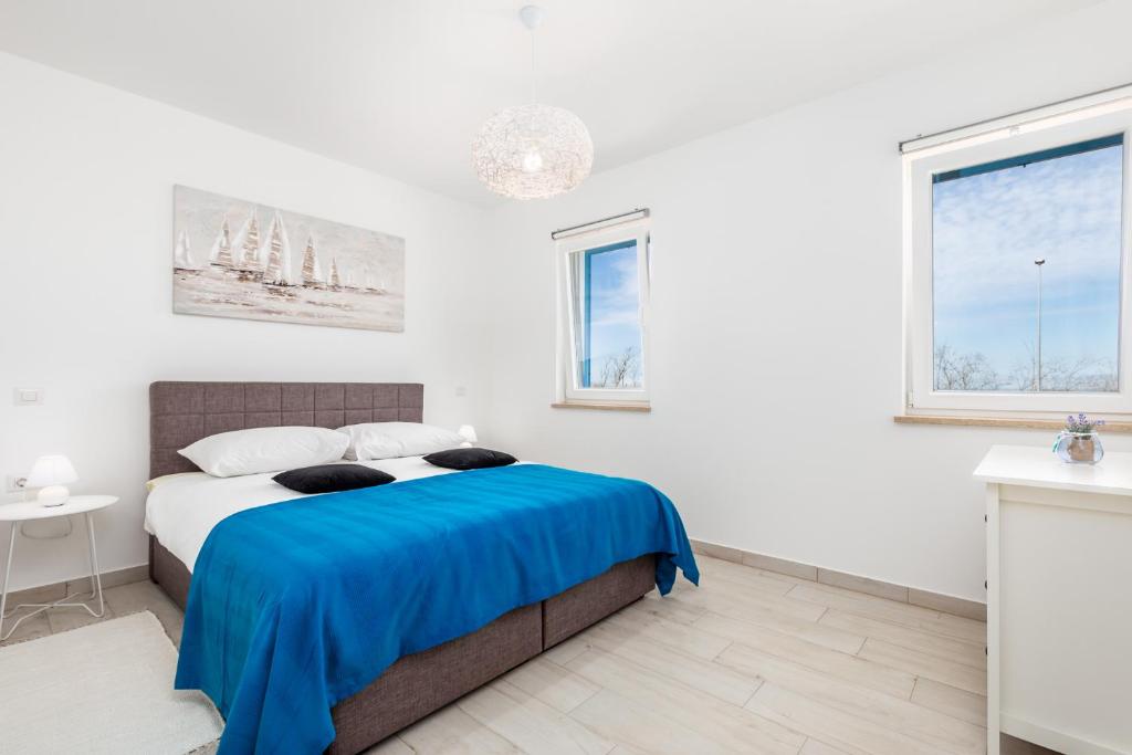 Posteľ alebo postele v izbe v ubytovaní Olea Residence