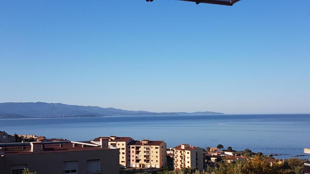 a view of a city and a body of water at Appartement Ajaccio vue mer panoramique in Ajaccio