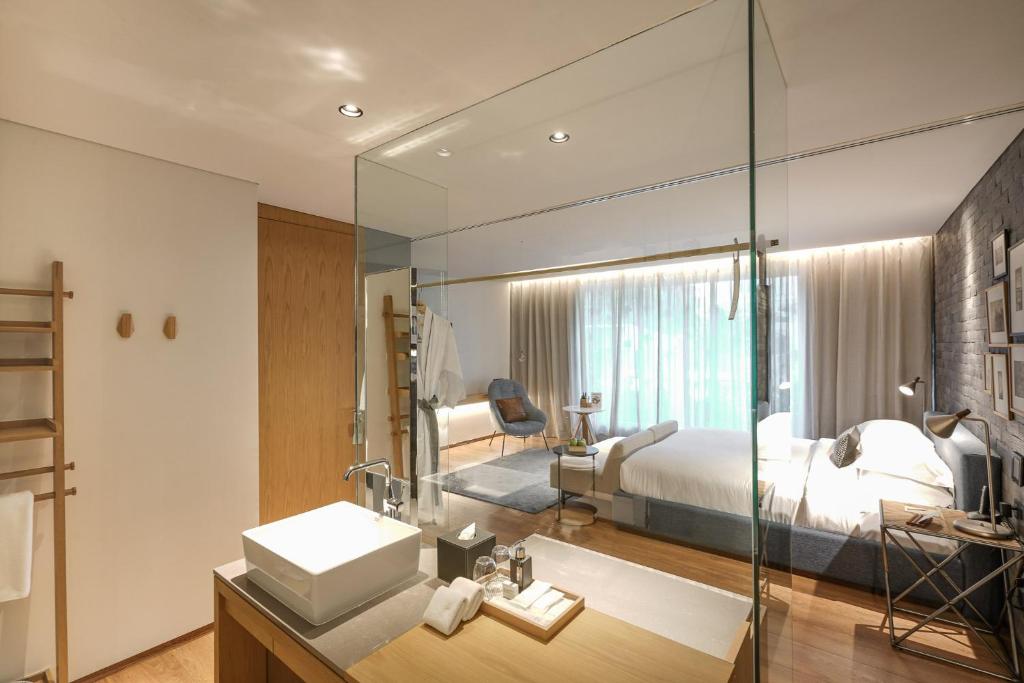 Postel nebo postele na pokoji v ubytování Ad Lib Hotel Bangkok