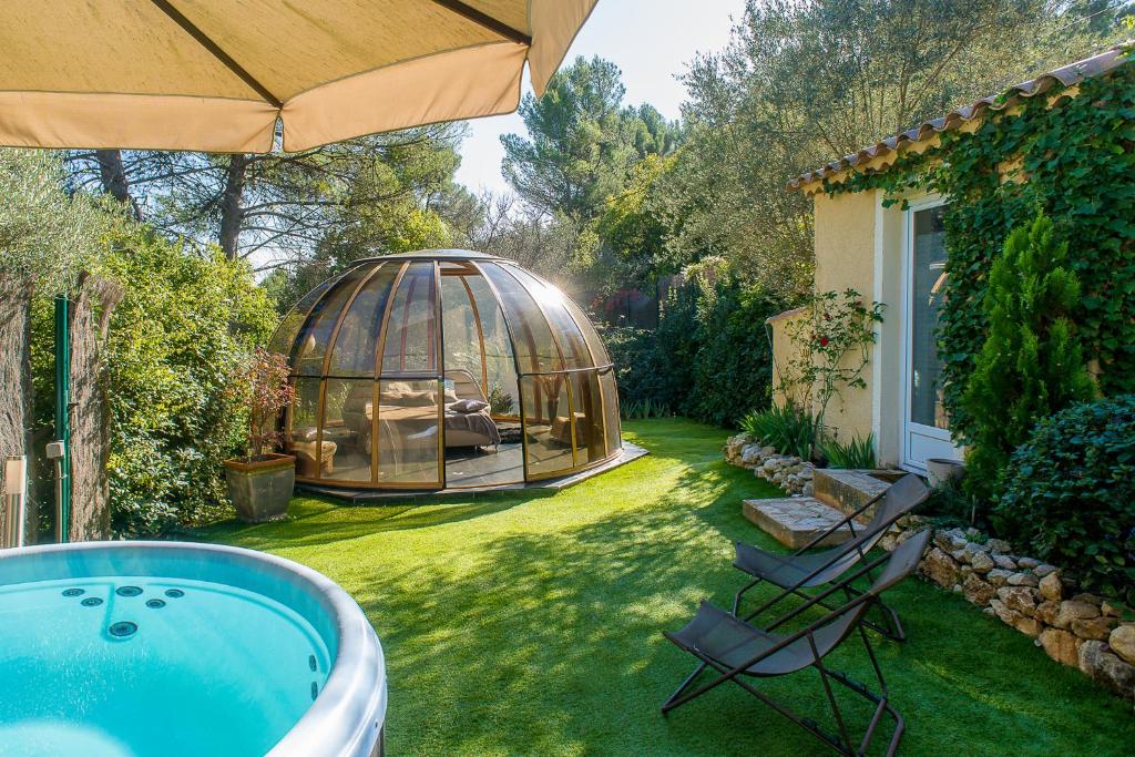a garden with a gazebo and a hot tub at Domaine Jobert in Aubagne