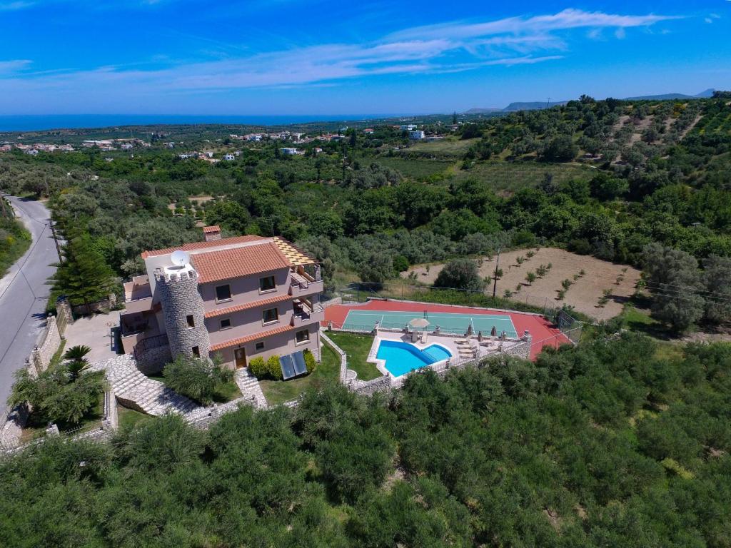an aerial view of a house with a swimming pool at Villa Tinadora in Agia Triada