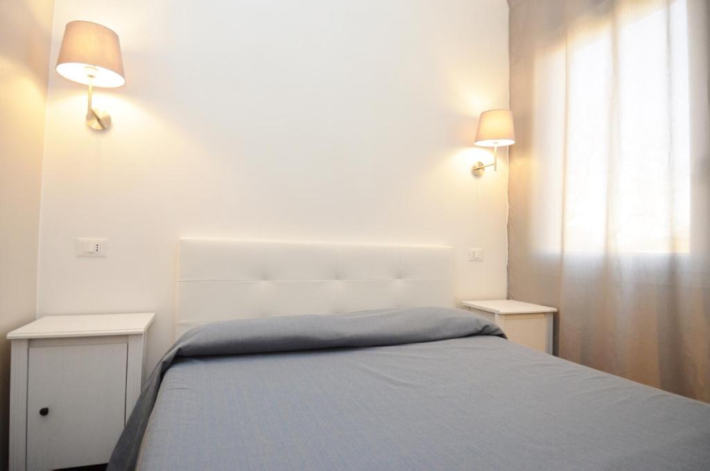 Postel nebo postele na pokoji v ubytování Ute Hotel