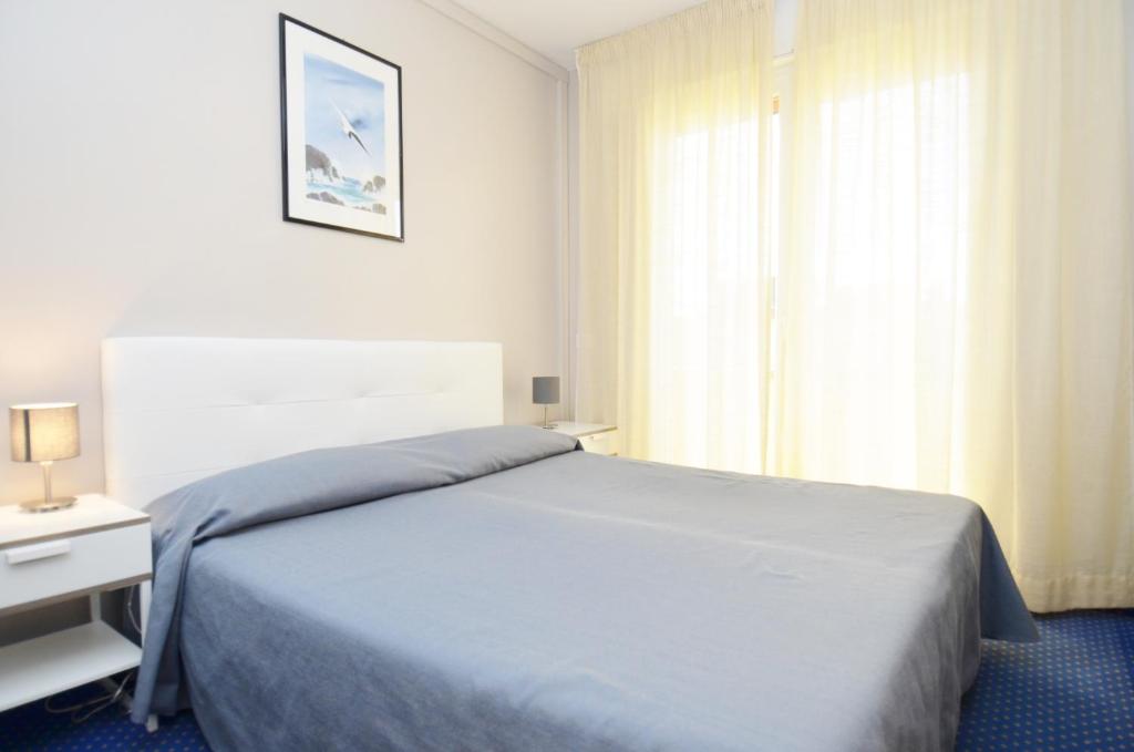 Postel nebo postele na pokoji v ubytování Ute Hotel