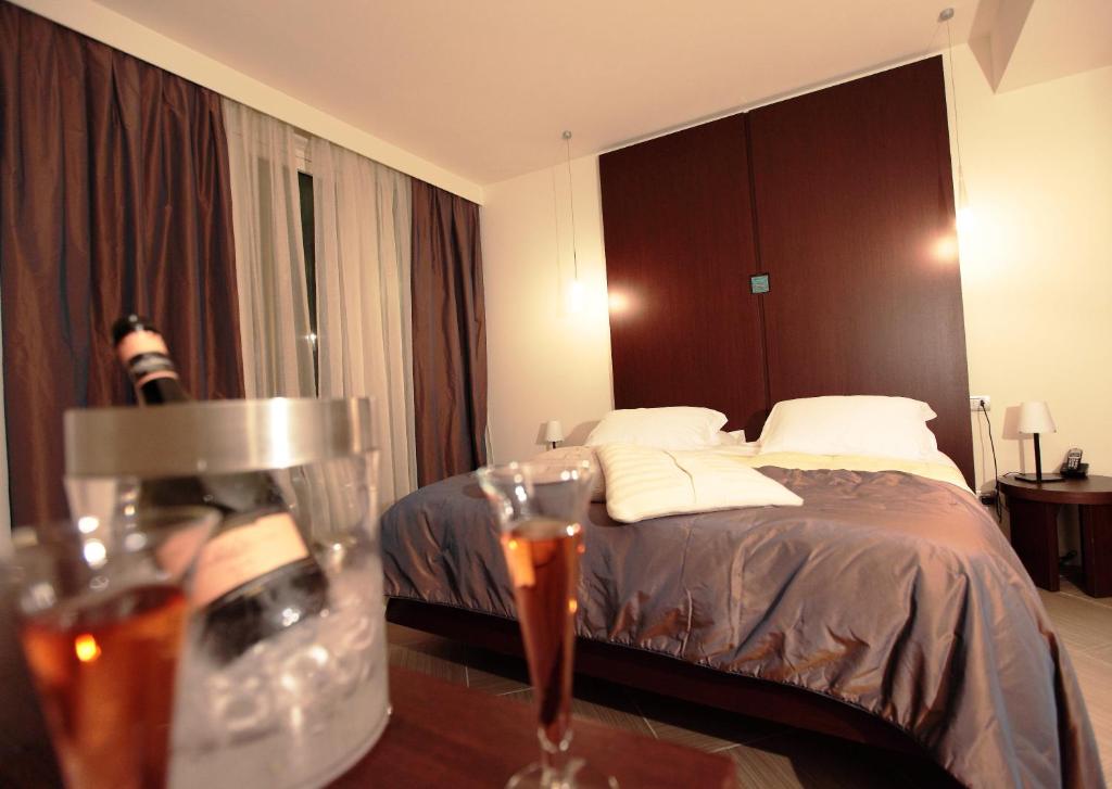 Postel nebo postele na pokoji v ubytování Blu Suite Resort