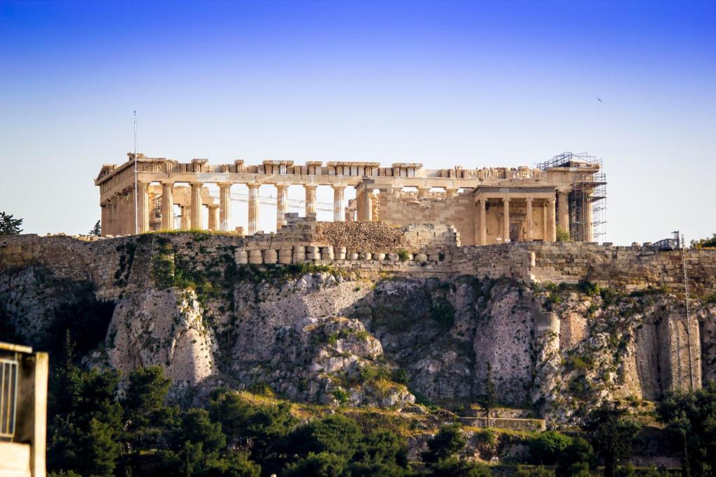 an ancient building on top of a mountain at Feel Athens Studios at Monastiraki in Athens