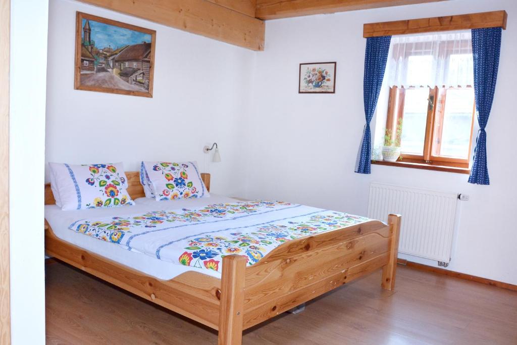 Postel nebo postele na pokoji v ubytování Penzion v Podhradí