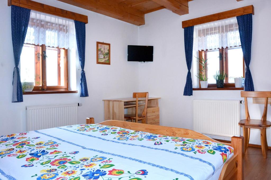 Postel nebo postele na pokoji v ubytování Penzion v Podhradí