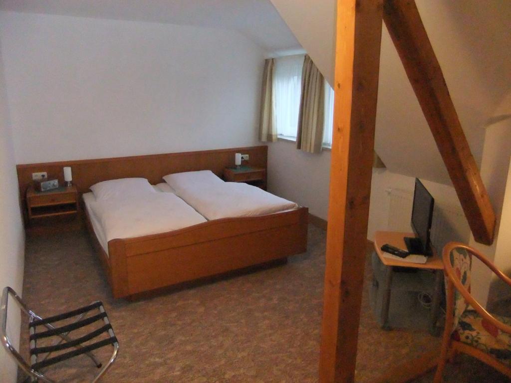 Postel nebo postele na pokoji v ubytování Gasthof Rotes Roß