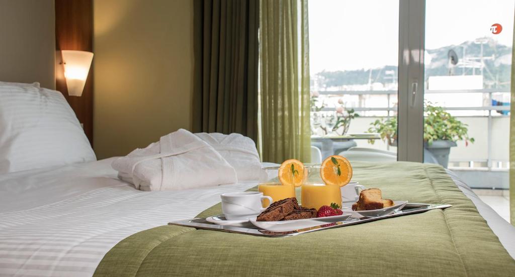 Postel nebo postele na pokoji v ubytování Polis Grand Hotel