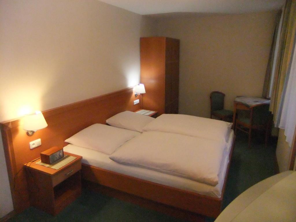 Postel nebo postele na pokoji v ubytování Gasthof Rotes Roß