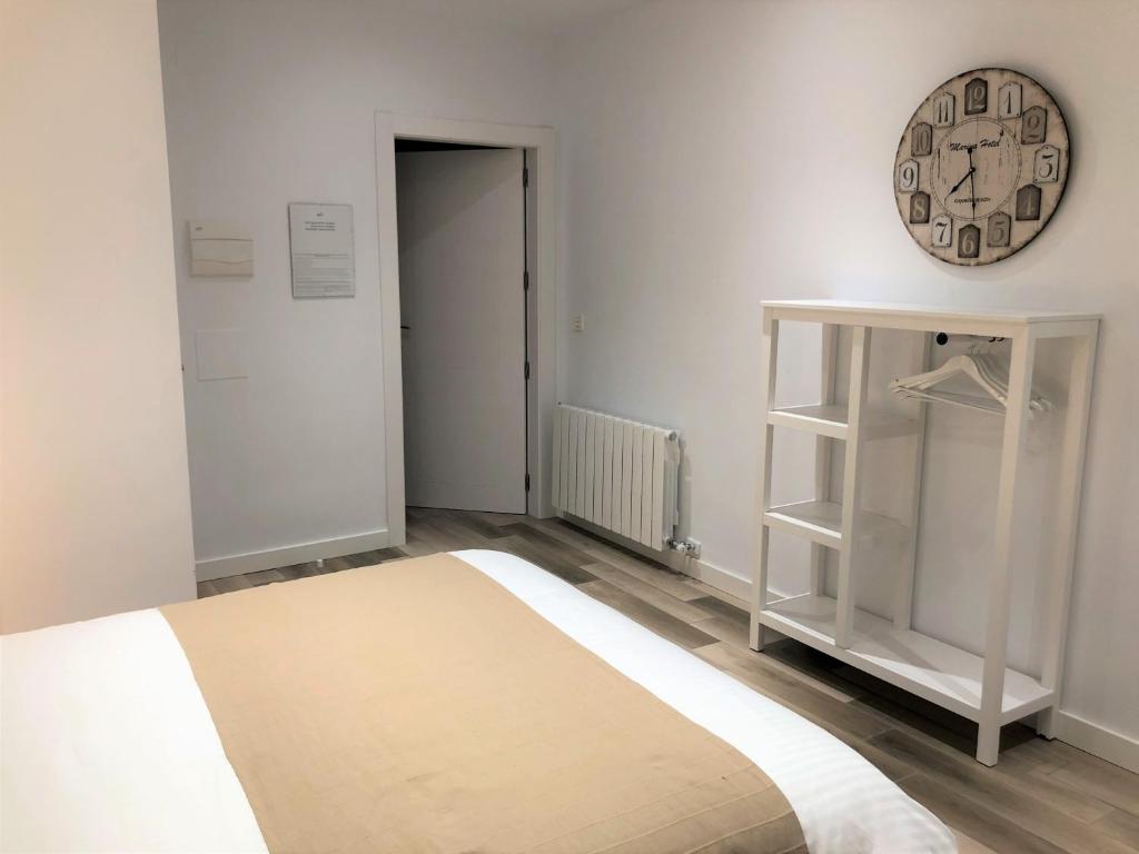 Postel nebo postele na pokoji v ubytování Apartamentos Centro en Recogidas, Granada