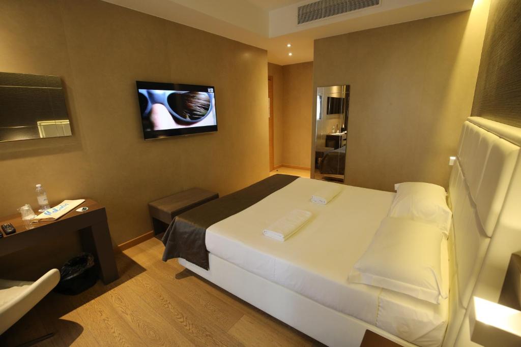 Posteľ alebo postele v izbe v ubytovaní Mokinba Hotels Baviera