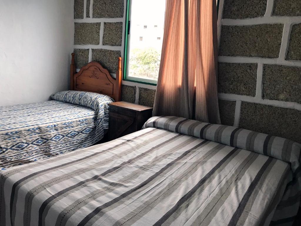 Postel nebo postele na pokoji v ubytování Casa Maria Luisa