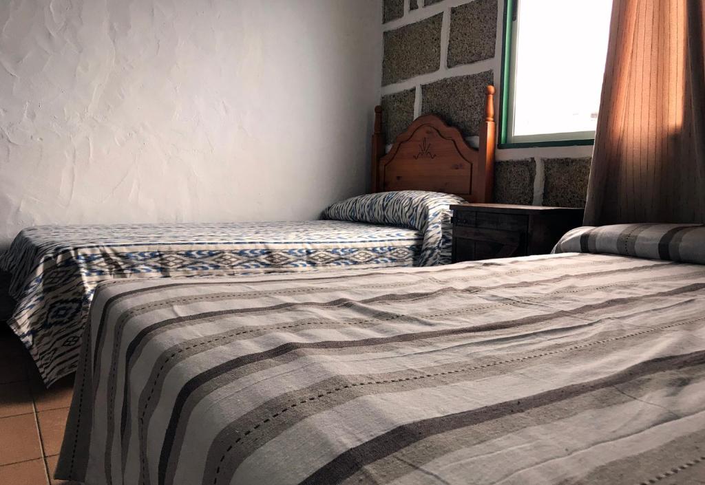 Postel nebo postele na pokoji v ubytování Casa Maria Luisa