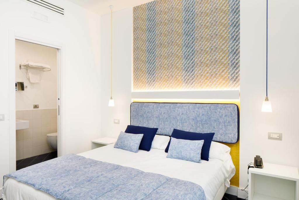 Postel nebo postele na pokoji v ubytování Hotel Nice