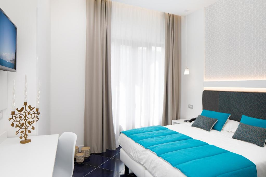 Postel nebo postele na pokoji v ubytování Hotel Nice