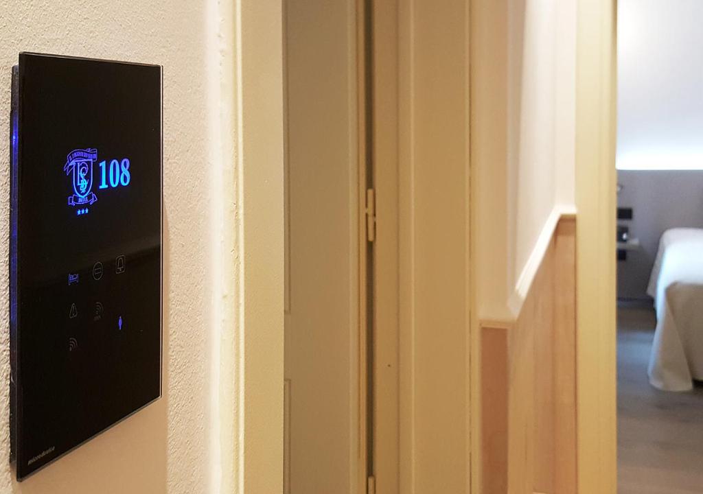 Postel nebo postele na pokoji v ubytování Hotel Il Loggiato Dei Serviti