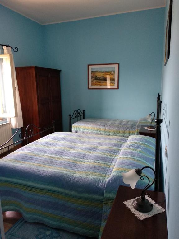 Łóżko lub łóżka w pokoju w obiekcie Agriturismo San Fedele
