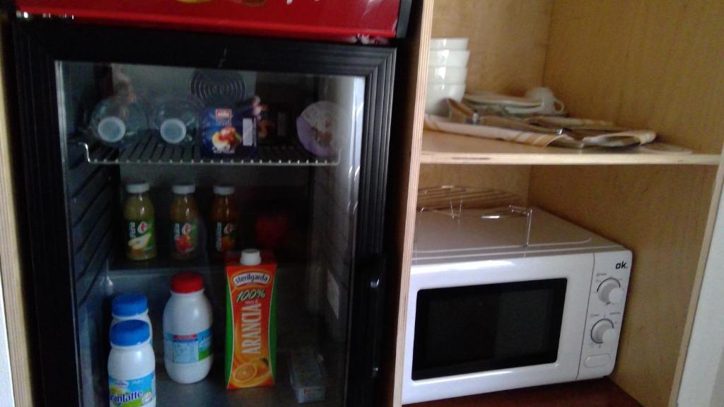 Kuchyň nebo kuchyňský kout v ubytování B&B Magenta