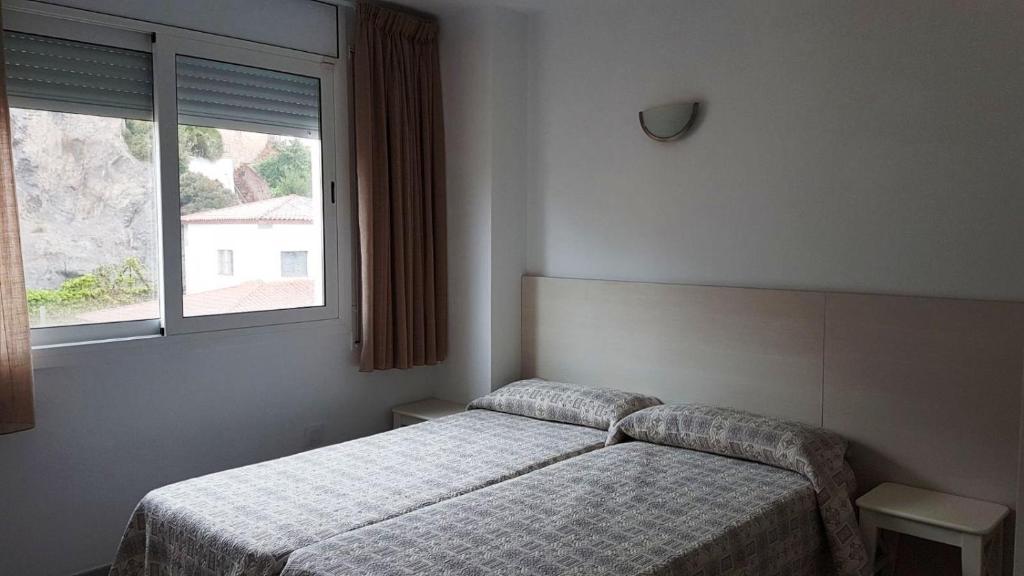 Postel nebo postele na pokoji v ubytování Apartaments Tropic
