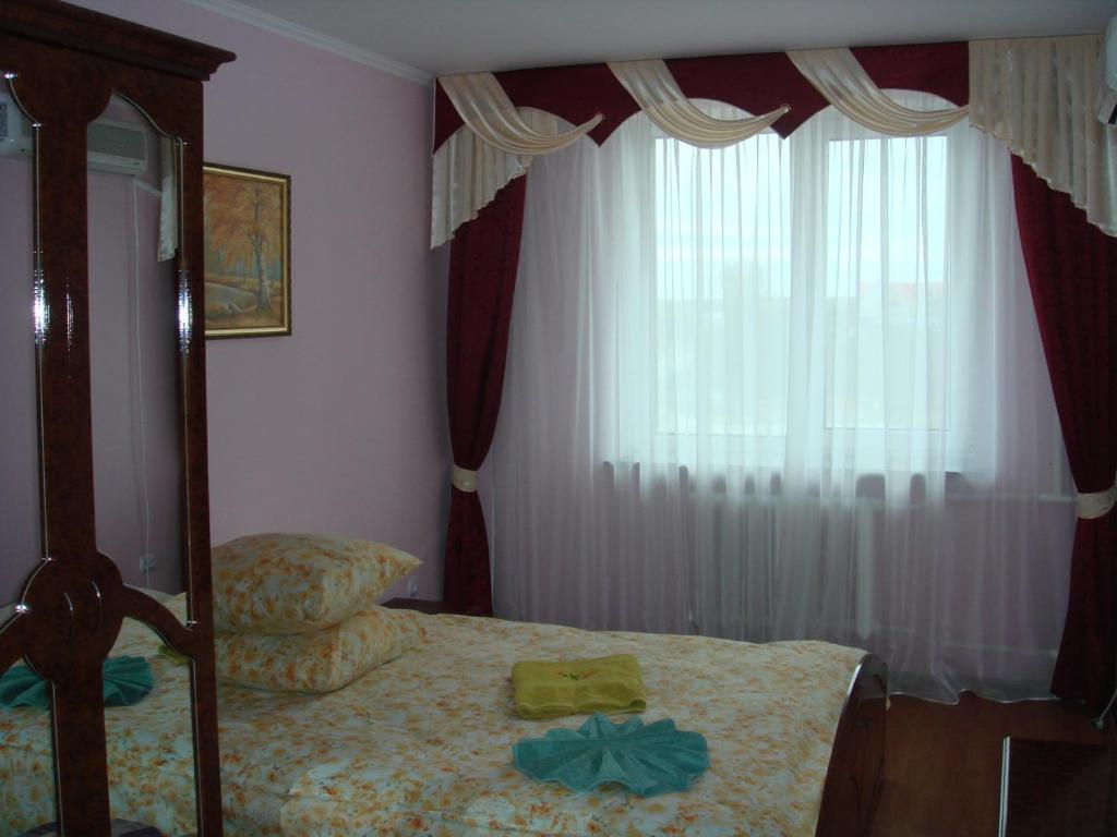 Postel nebo postele na pokoji v ubytování Hotel - restaurant "Lion's heart"