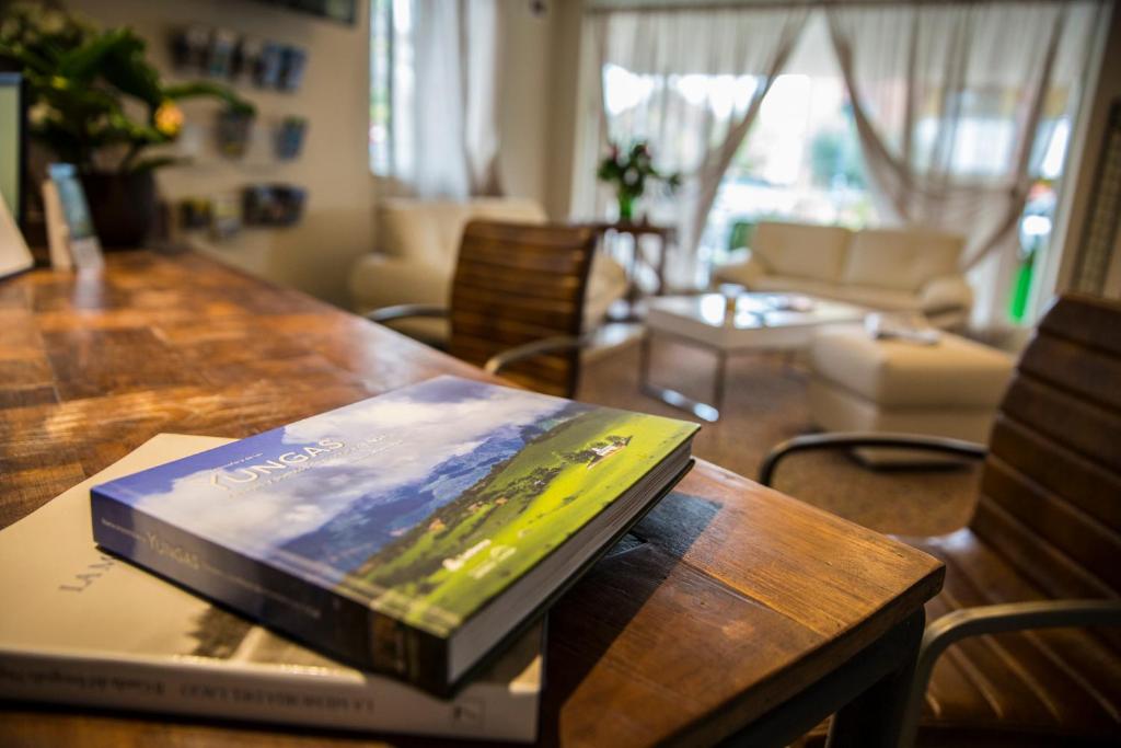 a book sitting on top of a wooden table at Hotel Buena Onda in Peschiera del Garda