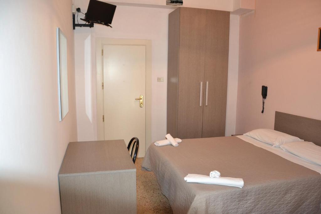 Postel nebo postele na pokoji v ubytování Hotel Britta