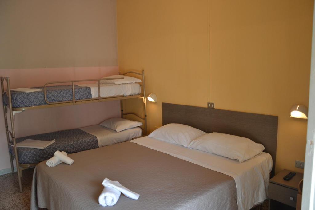 Postel nebo postele na pokoji v ubytování Hotel Britta