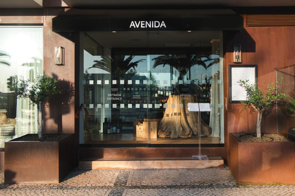 a clothing store window with a dress in it at Lagos Avenida Hotel in Lagos