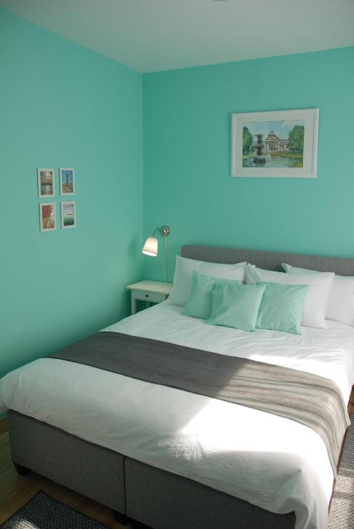 Posteľ alebo postele v izbe v ubytovaní Joy Guesthouse