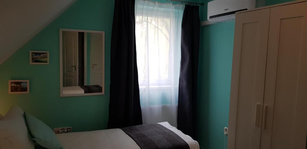 Posteľ alebo postele v izbe v ubytovaní Joy Guesthouse