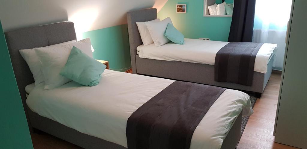 Posteľ alebo postele v izbe v ubytovaní Joy Guesthouse