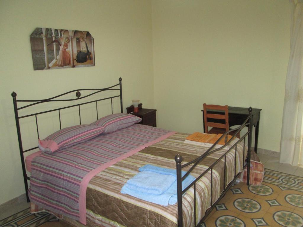 Posteľ alebo postele v izbe v ubytovaní Casa e Putia