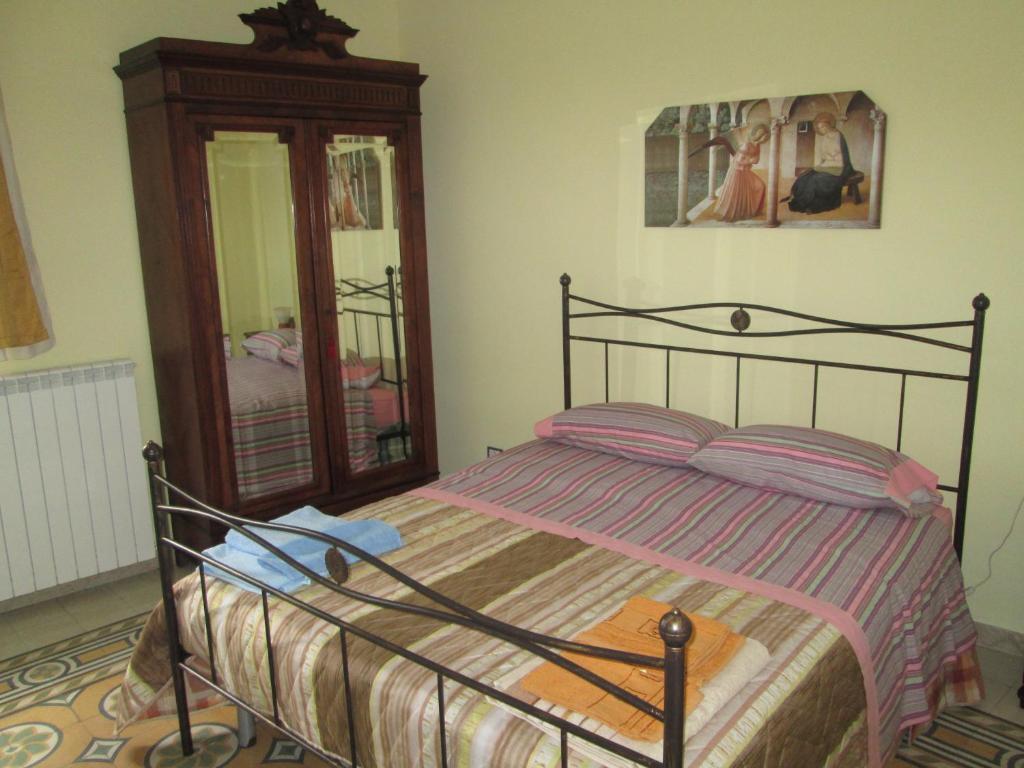 Posteľ alebo postele v izbe v ubytovaní Casa e Putia