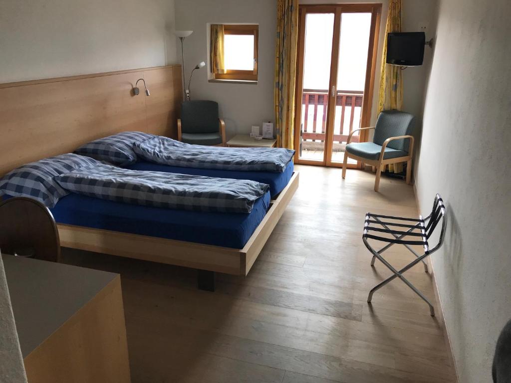 Postel nebo postele na pokoji v ubytování Hotel Restaurant Kulm