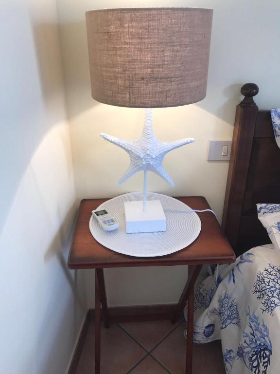 A bed or beds in a room at Favignana Margot House