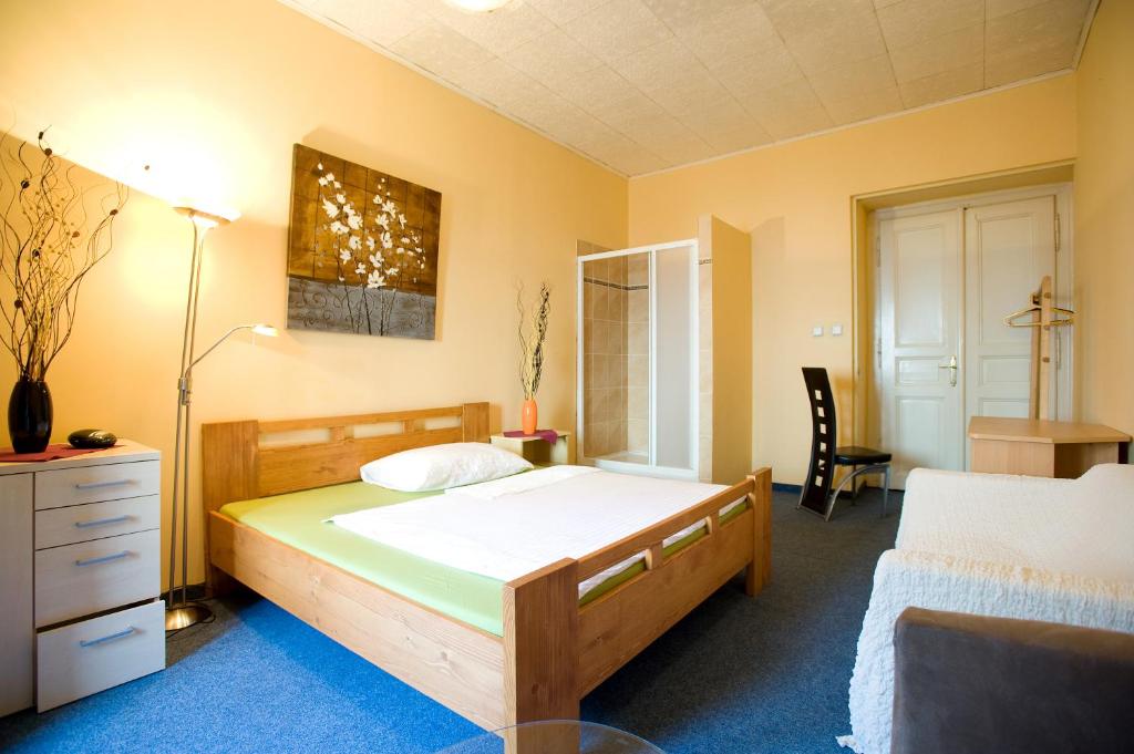 Postel nebo postele na pokoji v ubytování Hotel Praha Club bed & breakfast