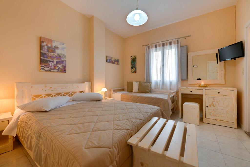 Postel nebo postele na pokoji v ubytování Villa Aegeon