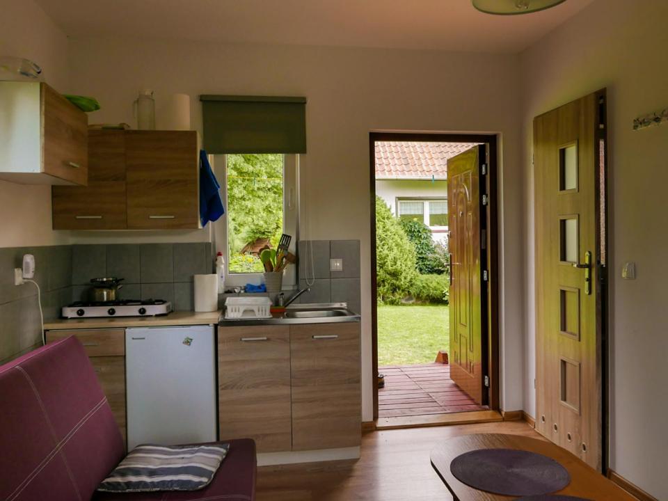 Kuchyňa alebo kuchynka v ubytovaní Domki letniskowe "Pod lipą"
